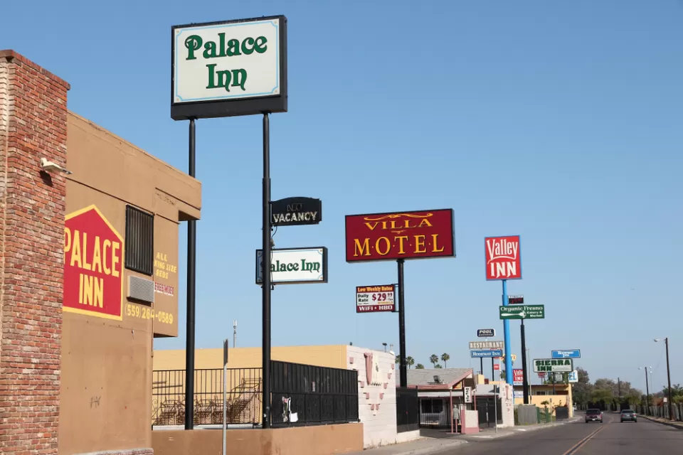 A row of motels on a wide street in Fresno, California
